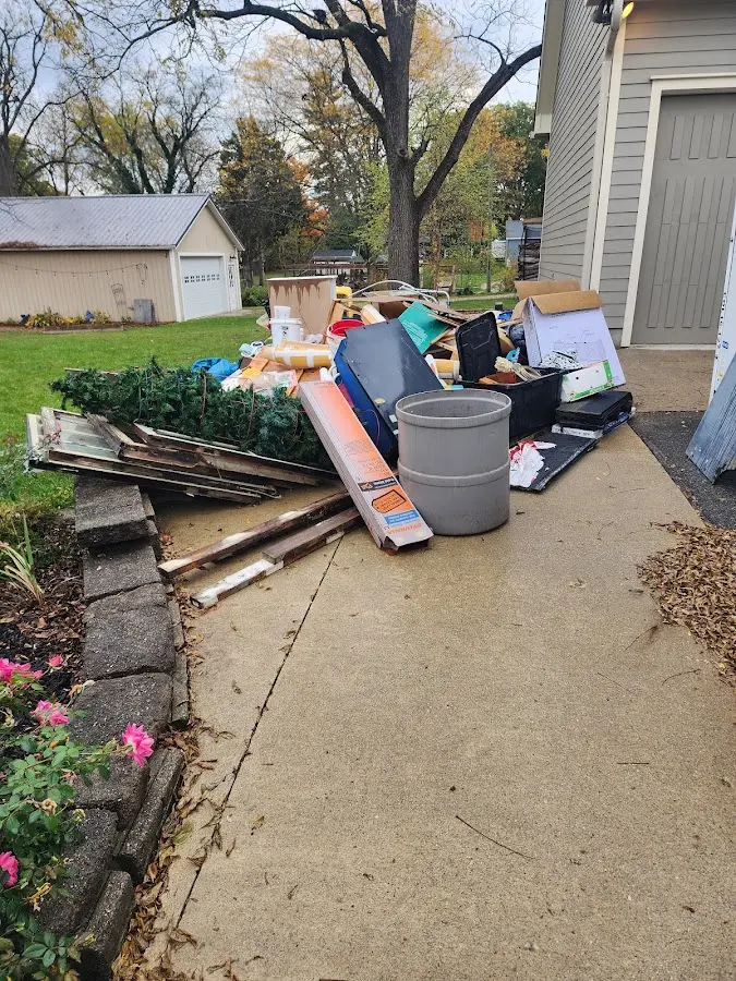 Dumpster being loaded with debris for 3 Yard Dumpster Rental in Boylston